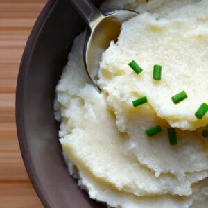An overhead shot of a bowl filled with garlic caulflower mashed potatoes.