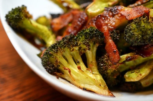Close up of roasted broccoli and bacon.