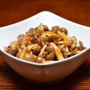 A bowl of paleo spicy sautéed mushrooms with anchovy.