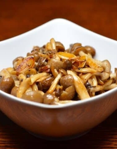 A bowl of paleo spicy sautéed mushrooms with anchovy.