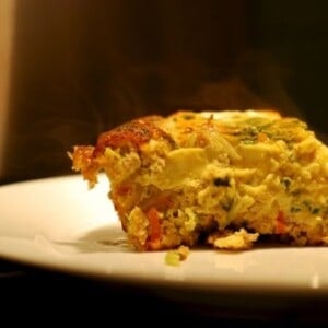 A slice of the paleo and whole30 curried ground pork and broccoli slaw frittata.