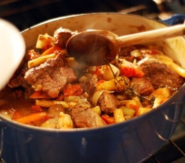 Oven-braised beef stew in a Dutch oven.