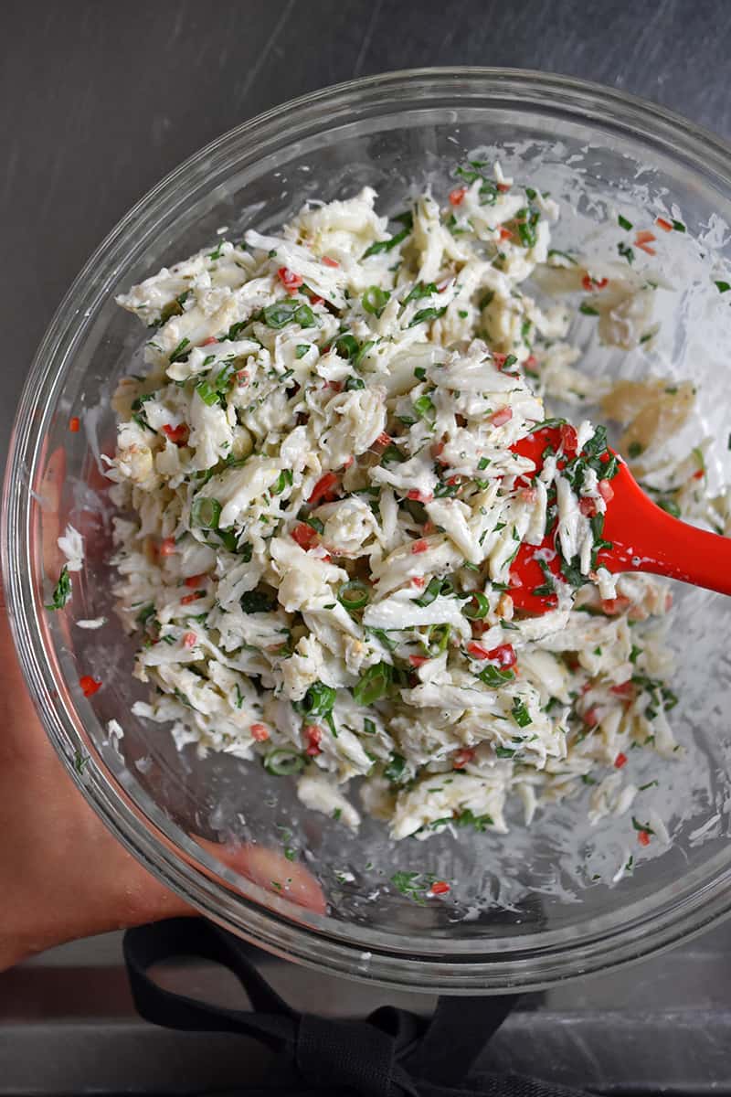 An overhead shot of a bowl of freshly made crab salad.