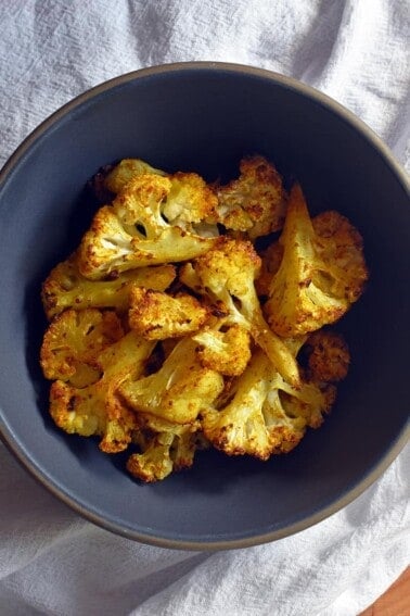 An overhead shot of a bowl of Roasted Curried Cauliflower