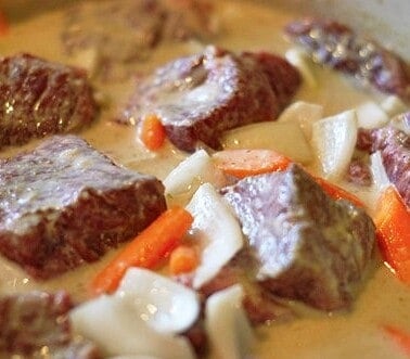 Beef short ribs cooked in a green curry.