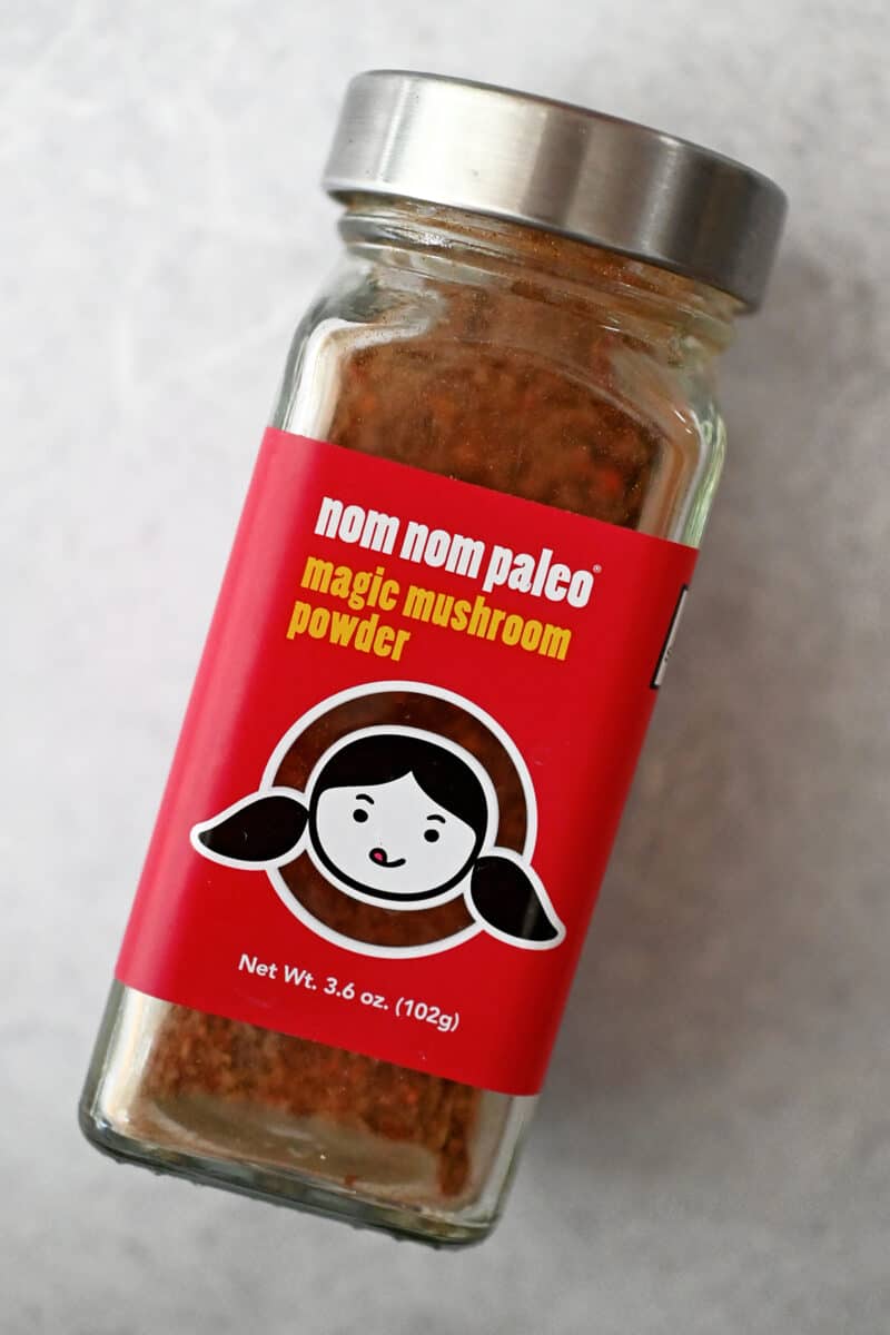 A bottle of Nom Nom Paleo's Magic Mushroom Powder.