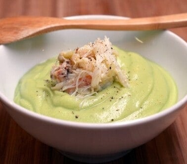 Bowl of chilled cream of avocado soup with dungeness crab