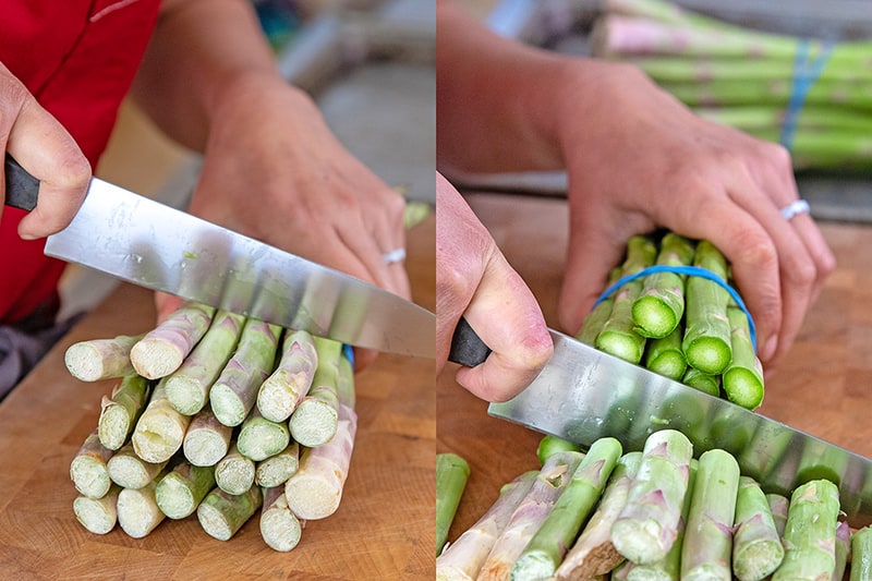 Trimming the tough ends off of a bunch of asparagus for Whole30 Prosciutto-Wrapped asparagus