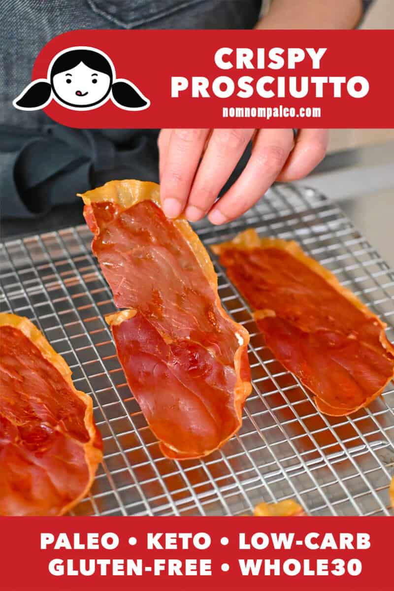 A hand is lifting a crispy prosciutto chip off of a wire cooling rack.