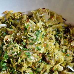 Warm Brussels Sprouts Slaw with Asian Citrus Dressing by Michelle Tam https://nomnompaleo.com