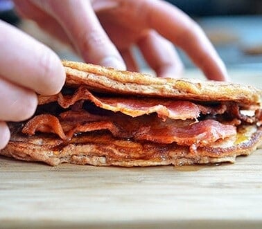 A side view of a Bacon Pancake Sandwich