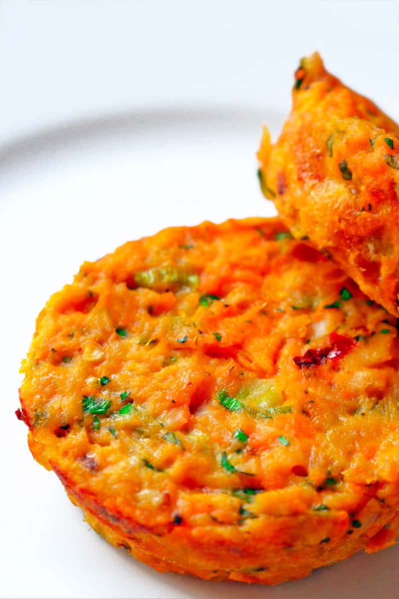 Two paleo and Whole30 spicy tuna cakes are on a white plate.