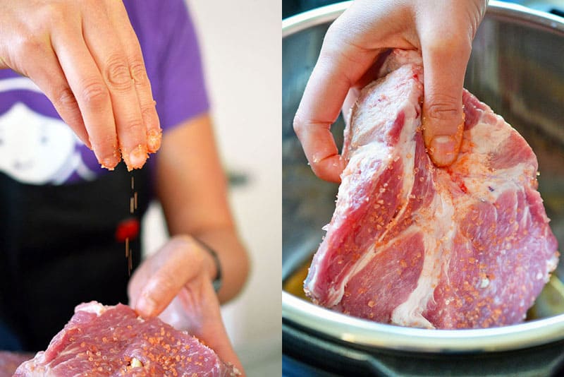 Seasoning the pork shoulder pieces for Instant Pot Kalua Pig with red alaea Hawaiian salt