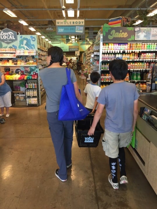 A family is shopping inside the Whole Foods in Maui