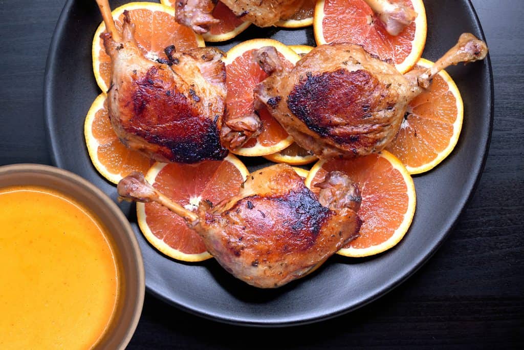 An overhead shot of a platter of Instant Pot (Pressure Cooker) Orange Duck + Gravy 