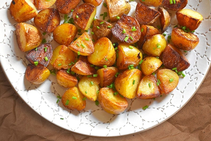 An overhead shot of Instant Pot (Pressure Cooker) Crispy Potatoes on a white platter.