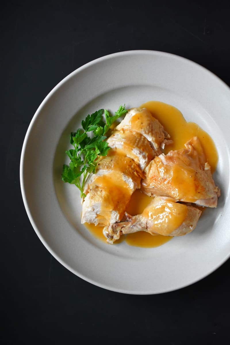 Instant Pot Whole30 chicken and gravy on a plate.