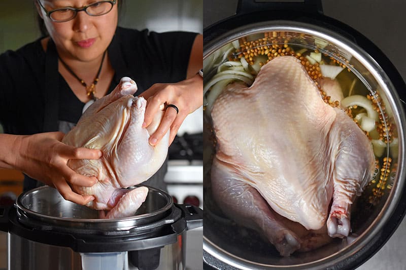 Placing a whole raw chicken into the Instant Pot, breast-side up