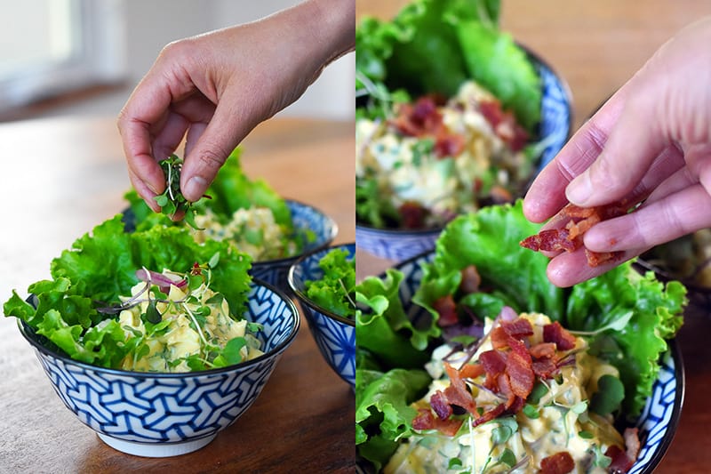 Bacon Deviled Egg Salad is topped with sprouts and crispy bacon bits.