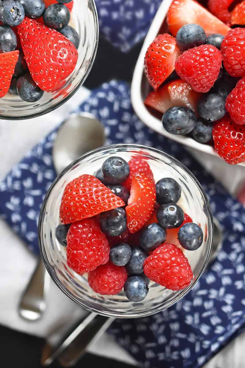 An overhead shot of Paleo Vanilla Pudding Parfaits with fresh berries.