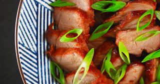 Here's my authentic Whole30-friendly, Paleo Char Siu recipe: Cantonese roasted pork lacquered with a sticky-sweet marinade.