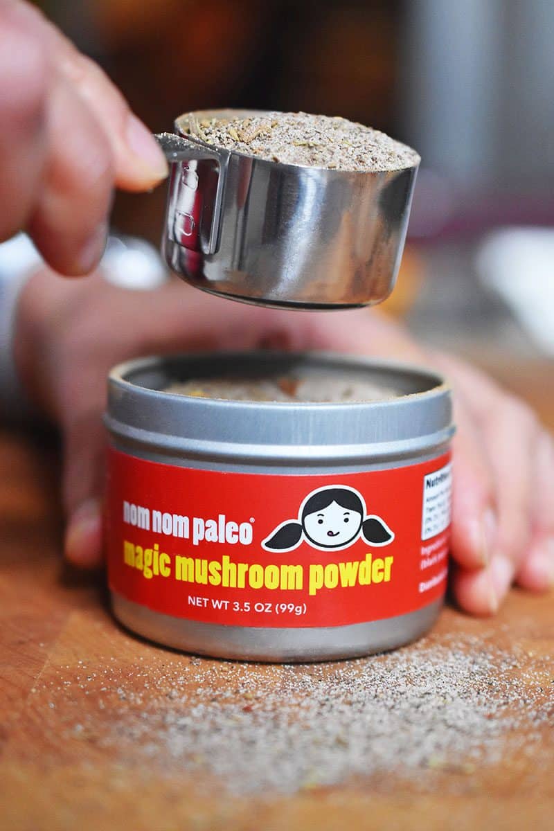 Scooping out magic mushroom powder by Nom Nom Paleo.