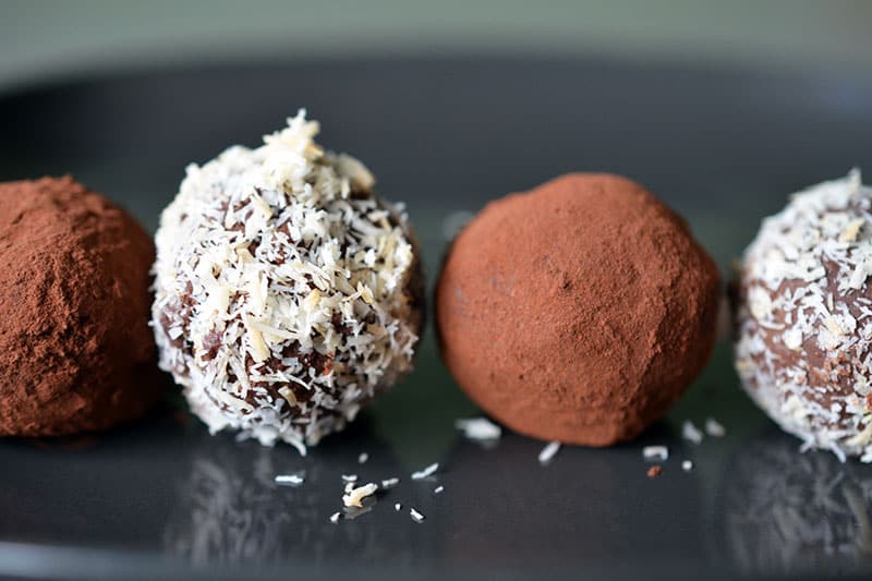 A closeup shot of paleo chocolate truffles, an easy Paleo Thanksgiving dessert.
