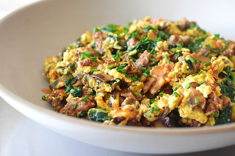 A side shot of Joe’s Scramble in a large shallow serving bowl.