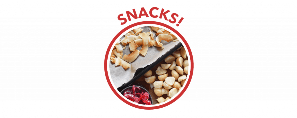 A red circle with the label "Snacks!" on top. Inside are toasted coconut flakes, macadamia nuts, and freeze dried strawberries.
