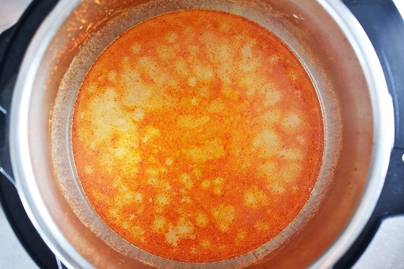 An overhead shot of the sauce for Instant Pot Thai Beef Curry in an open Instant Pot.