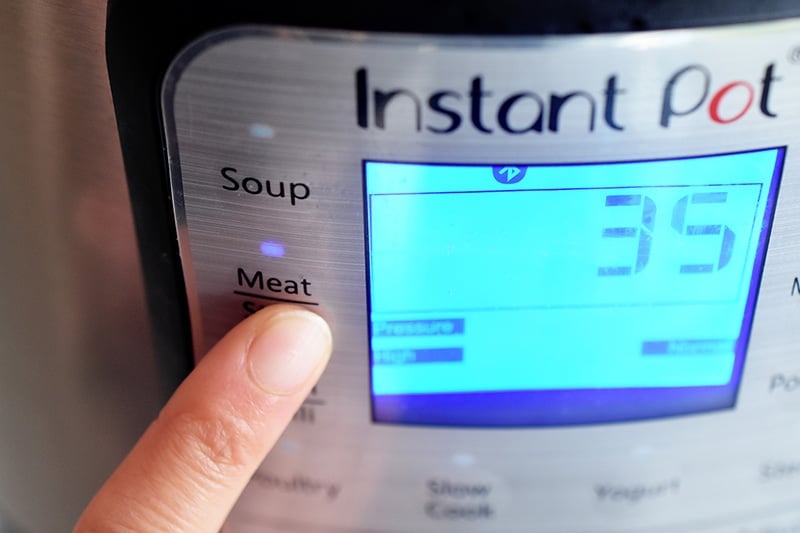A display on the Instant Pot shows 35 minutes under high pressure.