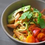 A beige bowl filled with Spicy Thai Chicken Zoodle Salad