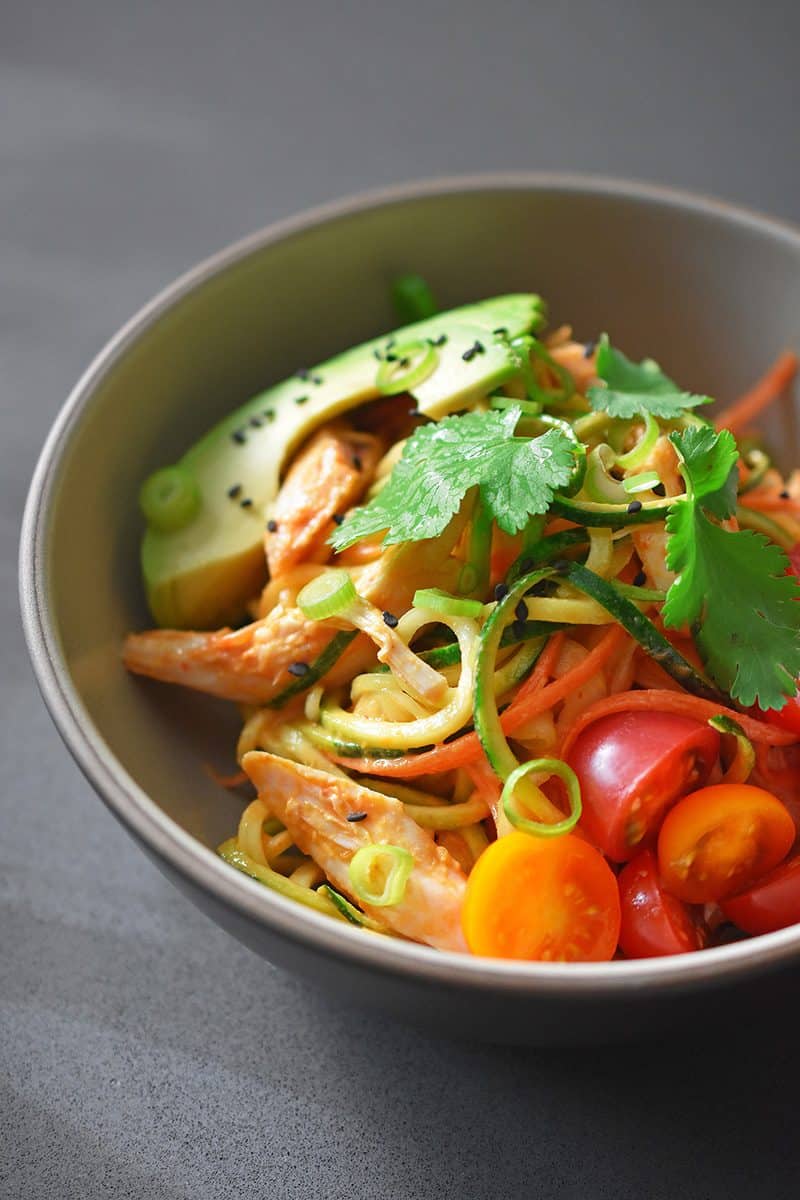 A bowl of spicy Thai chicken zoodle salad.