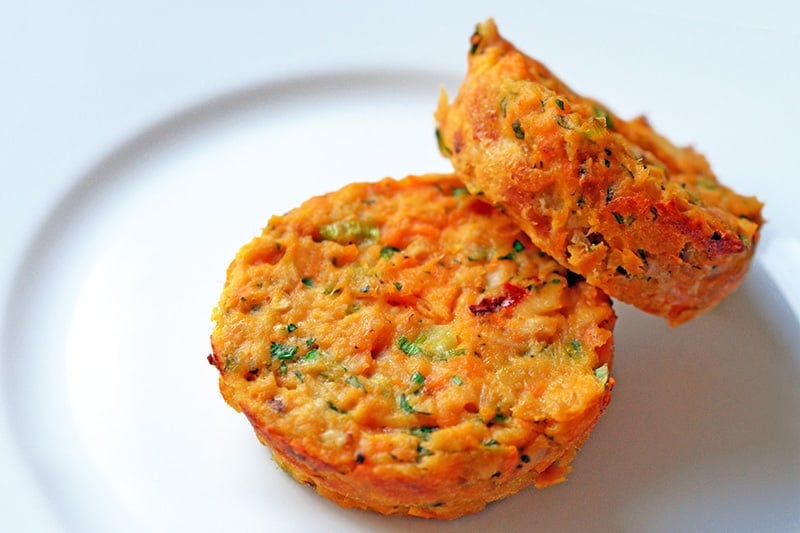 Two paleo spicy tuna cakes on a plate.