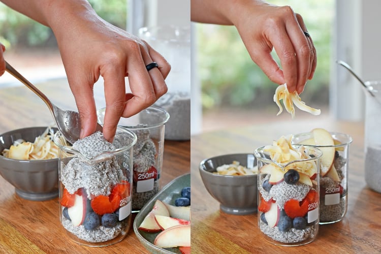 Someone assembling the paleo coconut chia puddings with fresh fruit and toasted coconut.