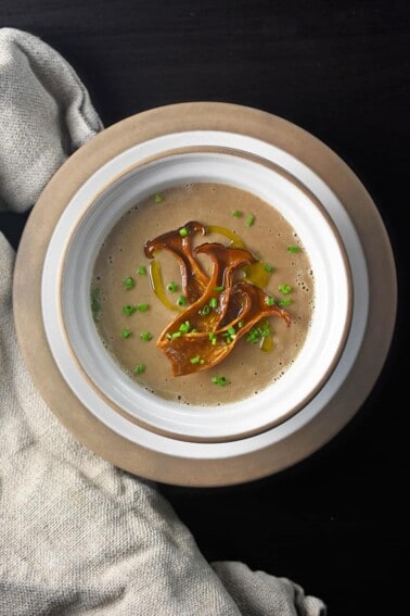An overhead shot of a bowl of Instant Pot Cream of Mushroom Soup , a paleo, keto, and Whole30 soup!