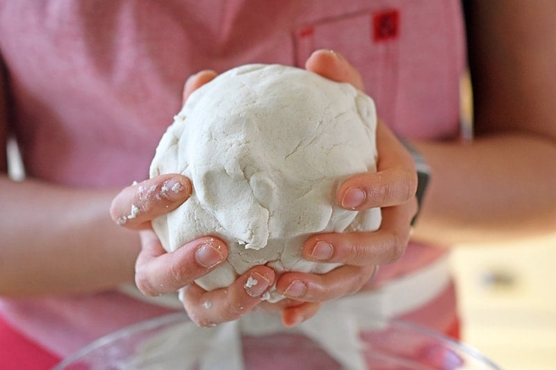 Forming the dough for Paleo Scallion Pancakes into a round ball.