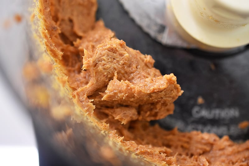 A closeup shot of pureed medjool dates to make the crust of No-Bake Matcha Cheesecake 