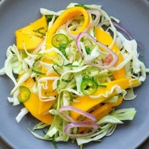 Spicy Mango Cabbage Slaw by Michelle Tam https://nomnompaleo.com