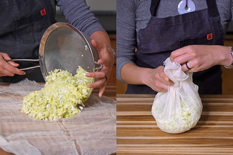 The salted cabbage is dumped onto a piece of cheese cloth and the edges are brought up to form a sack.