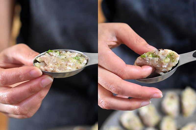 A narrow tablespoon is barely filled with the pot sticker filling. Use your finger to pop out the filling.