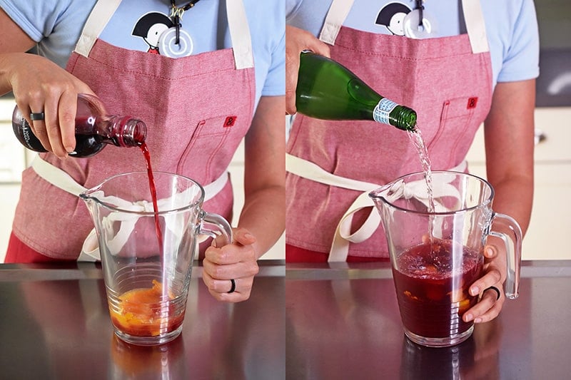 Pomegranate juice and sparkling water are being poured into the pitcher.