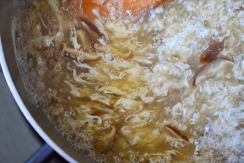A closeup of West Lake Beef Soup in a saucepan