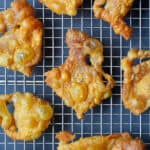 An overhead shot of Crispy Chicken Skin on a wire rack, the perfect paleo, Whole30, keto, and low carb snack.
