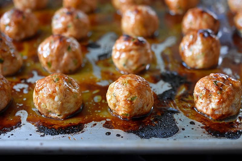 Baked Whole30 Tsukune that are nicely browned on top.