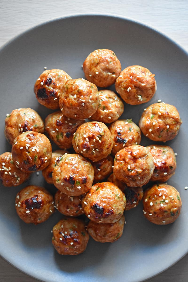 A platter piled high with Whole30-friendly tsukune, Japanese chicken meatballs.