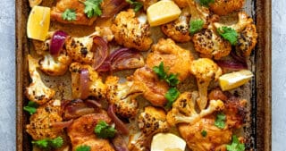 An overhead shot of healthy and easy sheet pan Chicken tandoori, a Whole30 and keto-friendly dinner!