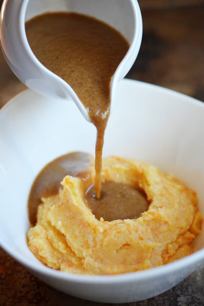 Umami gravy is poured on a root vegetable mash