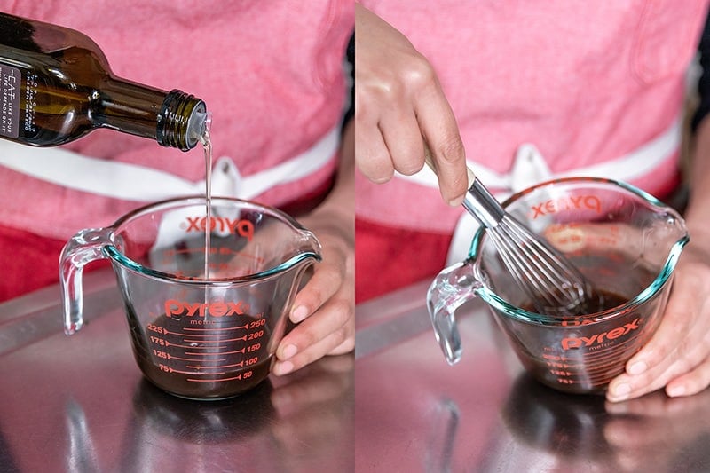 Pouring avocado oil into a liquid measuring cup filled with All-Purpose Stir-Fry Sauce. Whisking the contents together to make a simple Asian salad dressing.