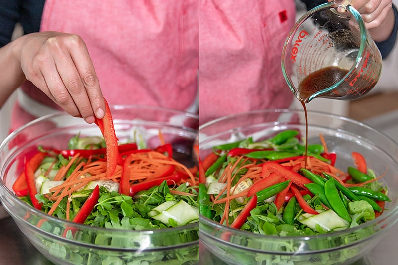 Adding the vegetables for Asian Steak Salad to a large salad bowl and pouring in the All-Purpose Stir-Fry Sauce.